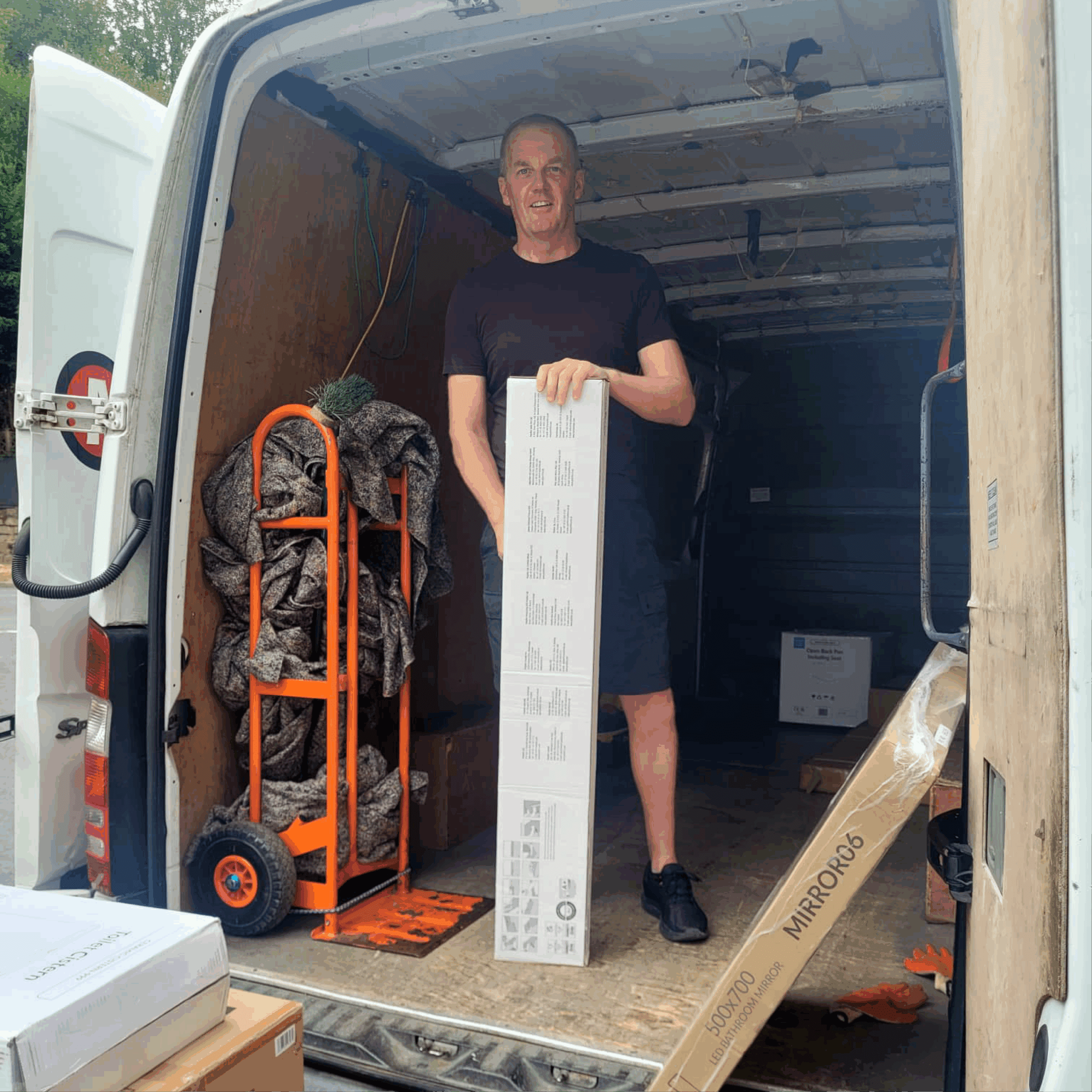 Aiden stood in the back of the removal van loading items carefully.