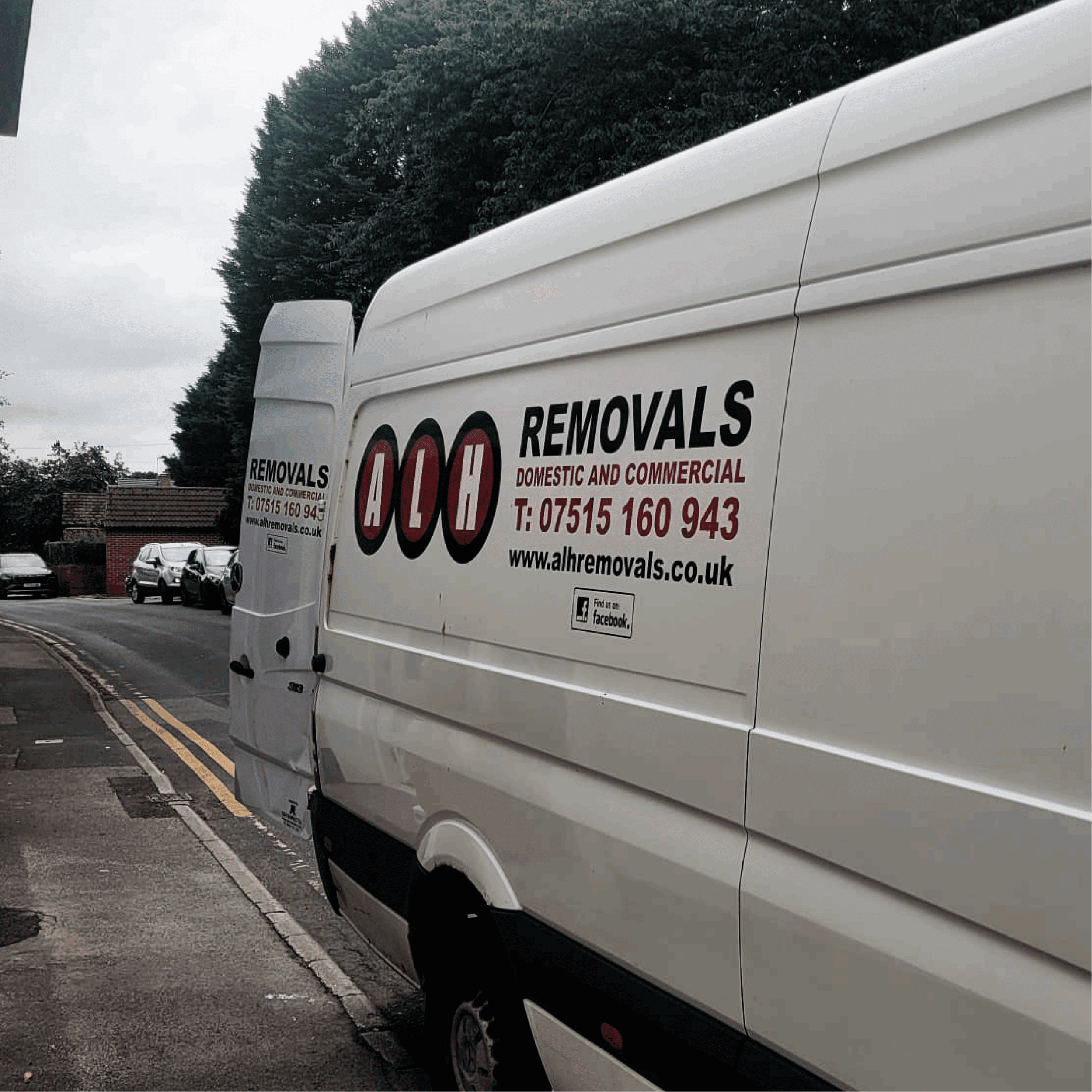 View of the side of the ALH removal van with the back door open.